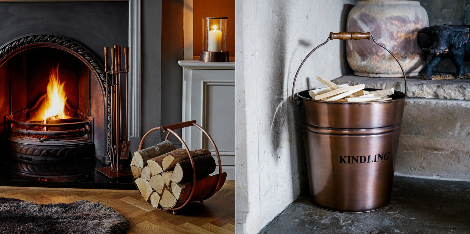 Ivyline fireside items - companion set, log holder, kindling bucket -  in Antique Brass in front of a roaring fire. 